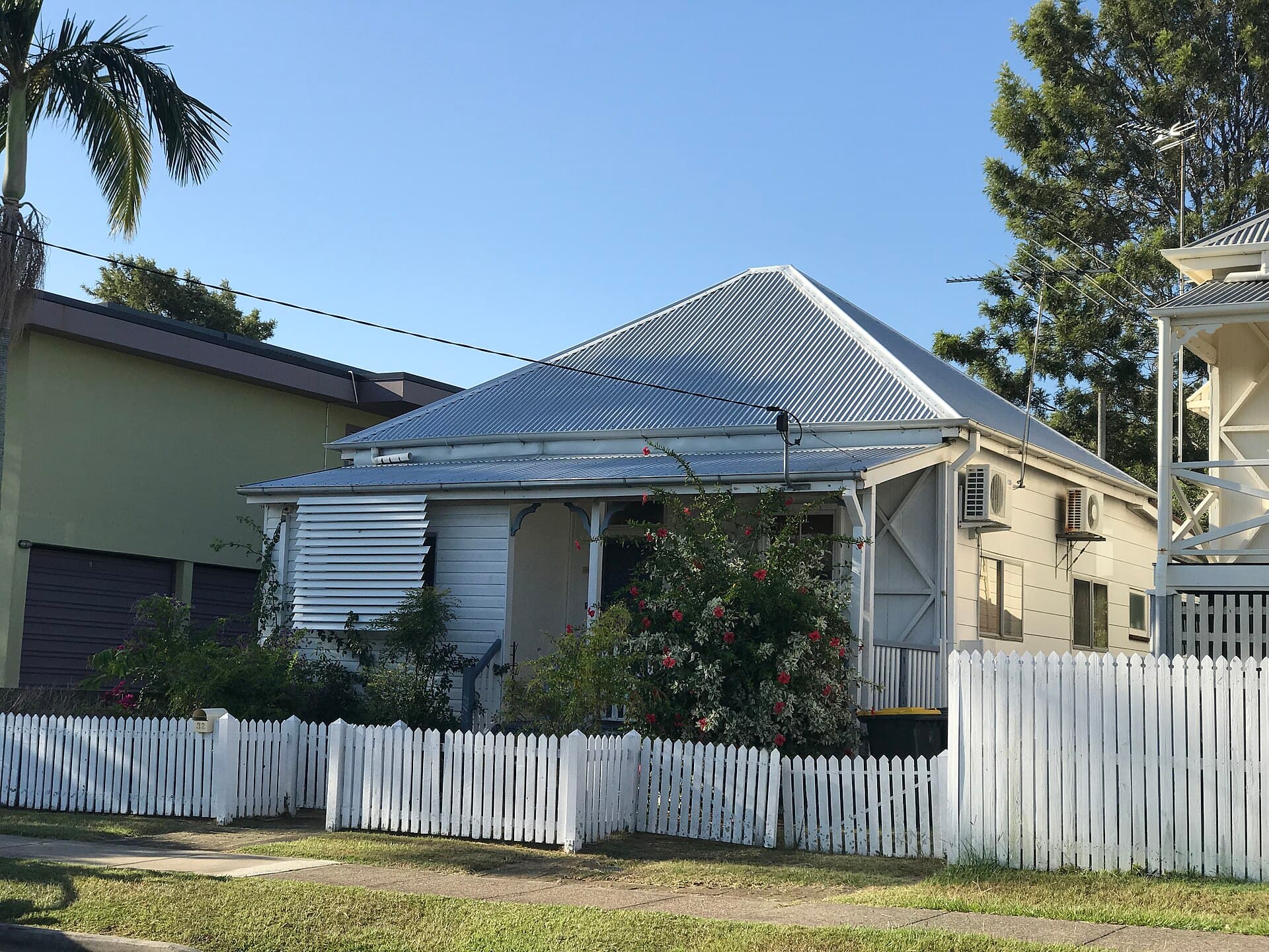 A Federation-era Clayfield house with a tiled roof, the sort of inner-north Brisbane place that still attracts both careful owner-operators and same-day canvassers.