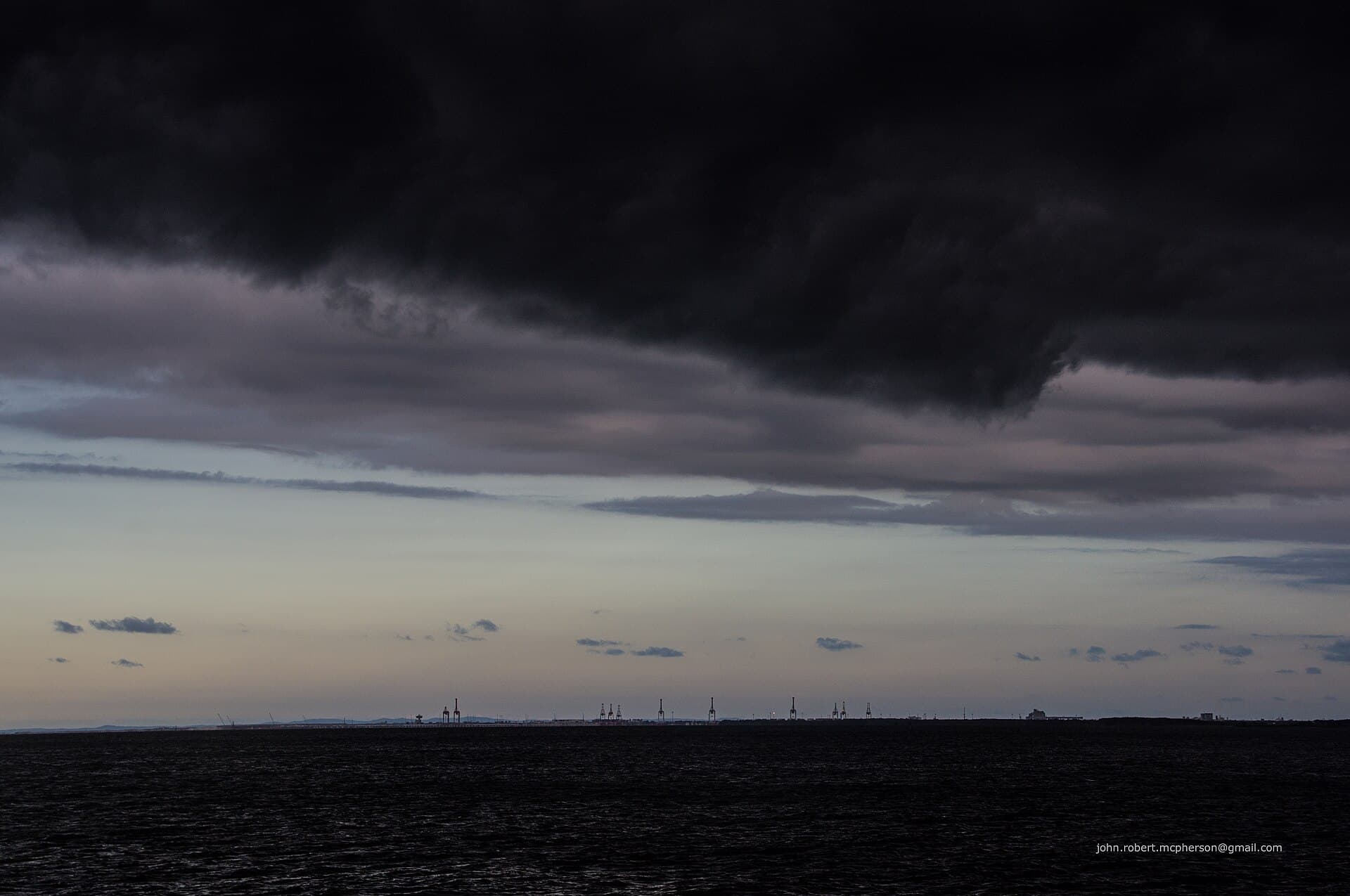 Evening thunderstorm shelf cloud over Bramble Bay, seen from Shorncliffe Pier